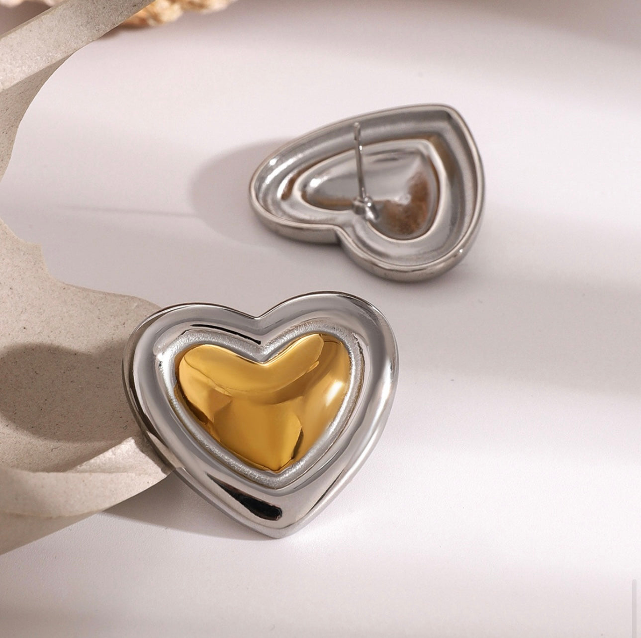 Two tone heart earrings