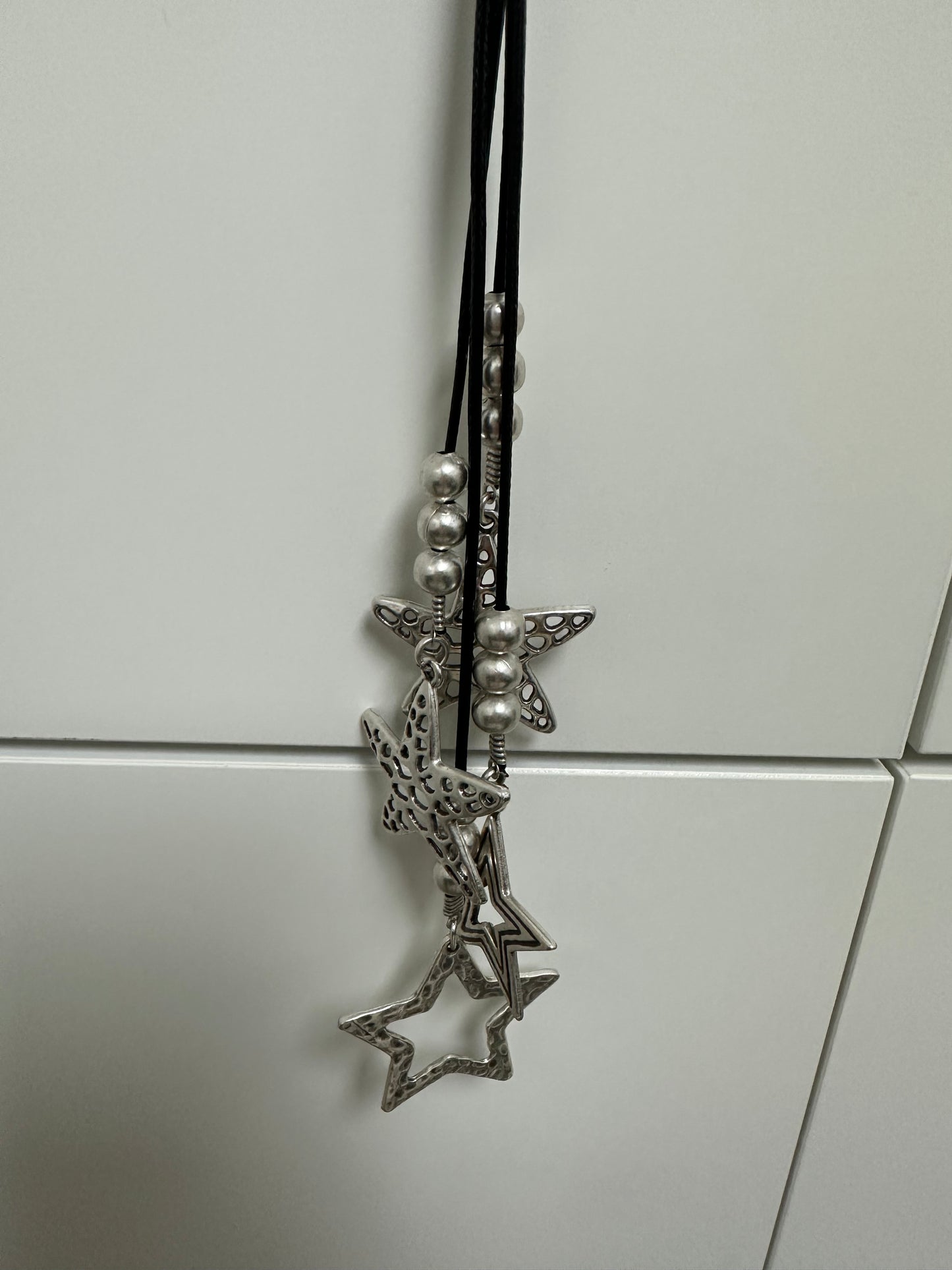 Silver and black star’s necklace