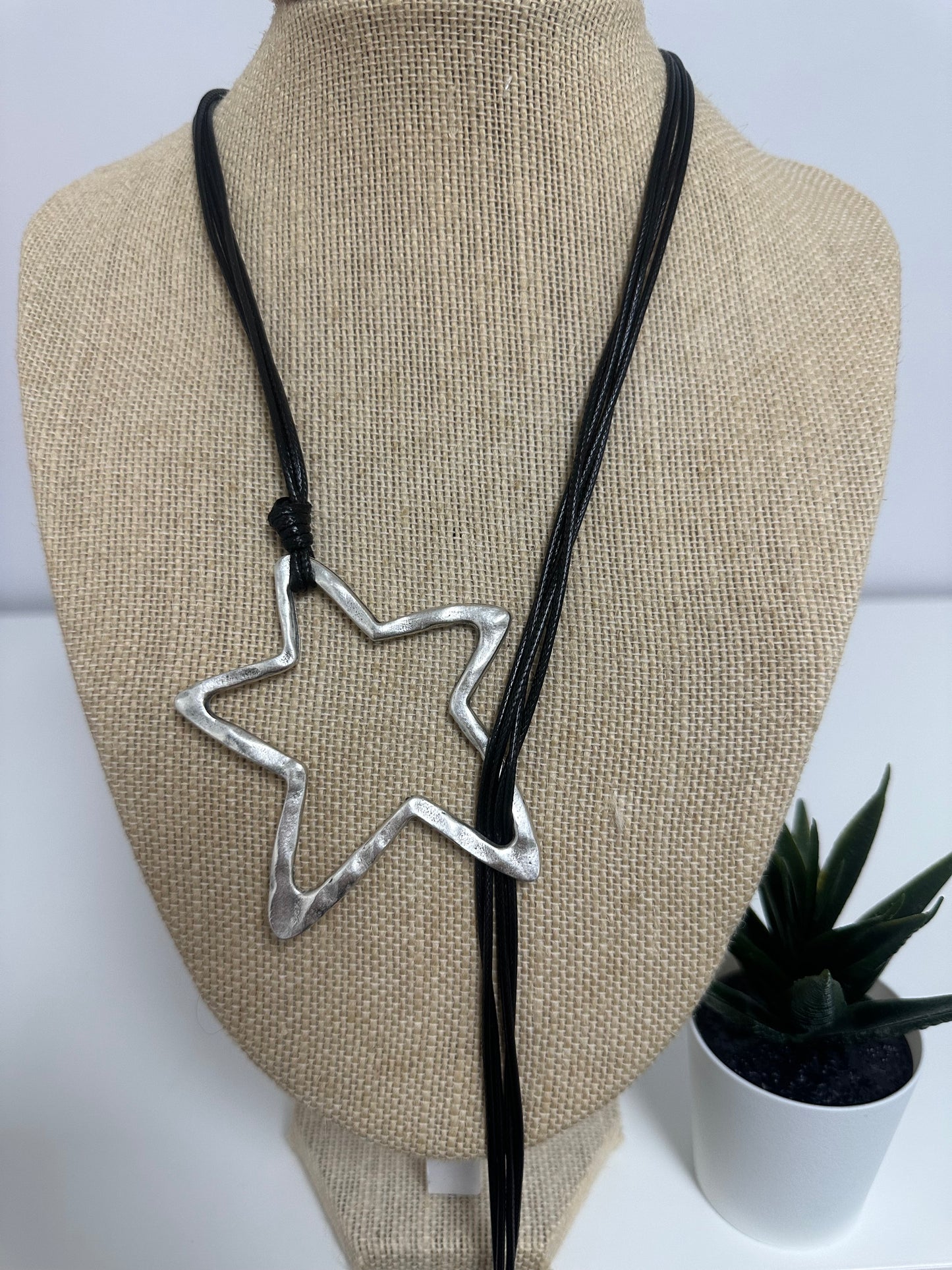 Silver and black star’s necklace